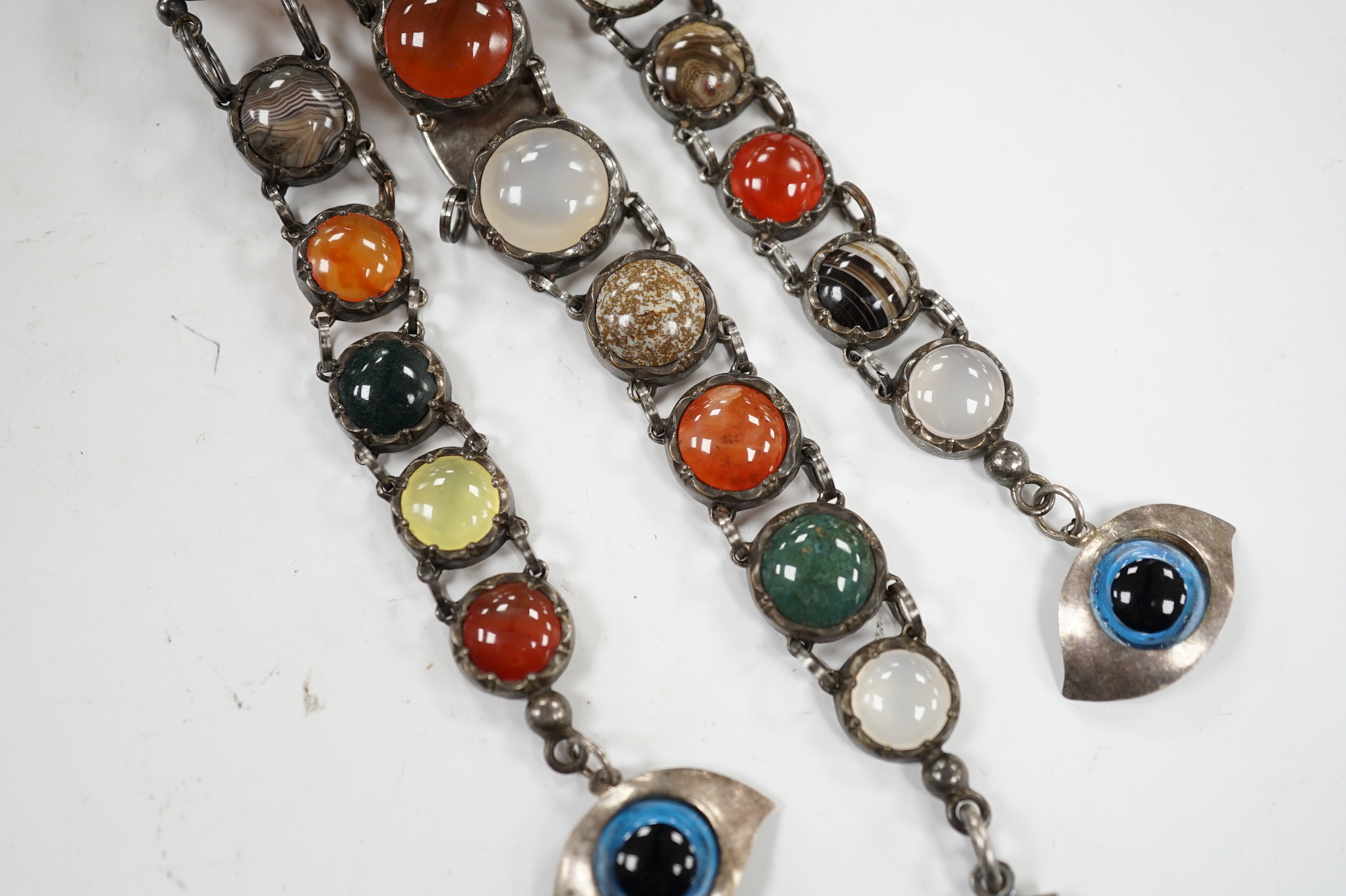 A white metal and cabochon multi gem set chatelaine, including jasper, carnelian and banded agate, 17cm.